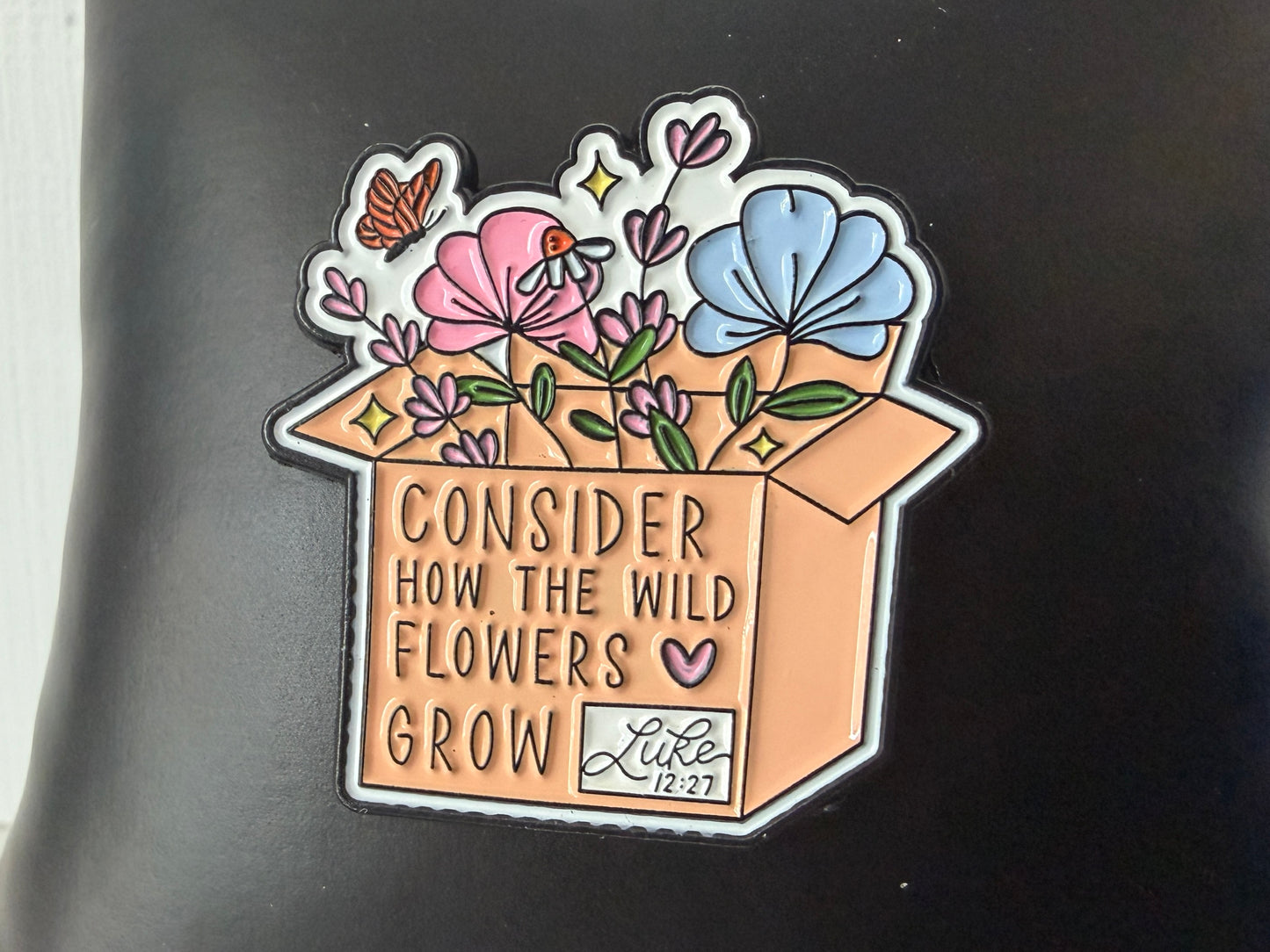 Consider the Wildflowers pin